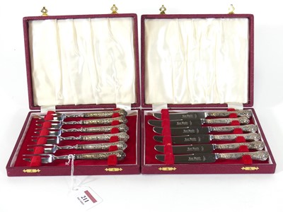 Lot 211 - A set of six silver handled tea knives;...