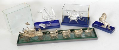 Lot 273 - A filigree white metal model of a stagecoach...