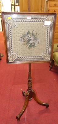 Lot 1127 - A mahogany polescreen, in the Regency taste,...