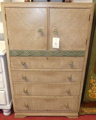 Lot 1139 - An Art Deco limed oak compactum chest, having...