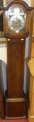 Lot 1142 - A 1930s oak Grandmother clock, the arched...