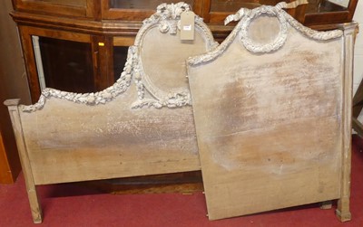 Lot 1208 - A French limed wood double bedstead (partially...