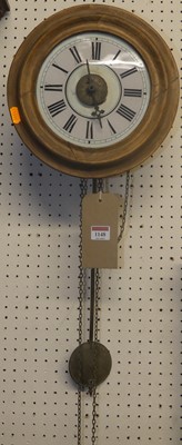 Lot 1148 - An early 20th century beech circular postman's...