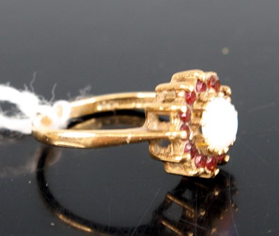 Lot 284 - A 9ct gold opal and garnet flowerhead cluster...