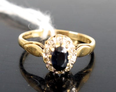 Lot 288 - A 9ct gold sapphire and diamond point...