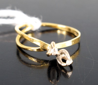 Lot 290 - An 18ct gold diamond crossover ring, each...