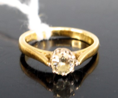 Lot 298 - An 18ct gold diamond solitaire ring, the claw...