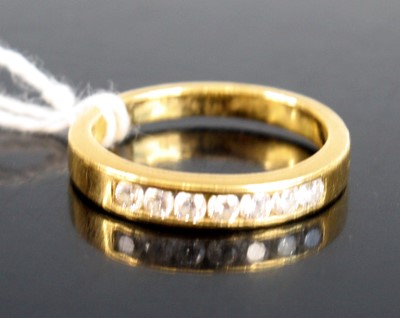 Lot 299 - An 18ct gold diamond half eternity ring,...