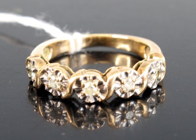 Lot 304 - A modern 9ct gold diamond half-hoop ring,...