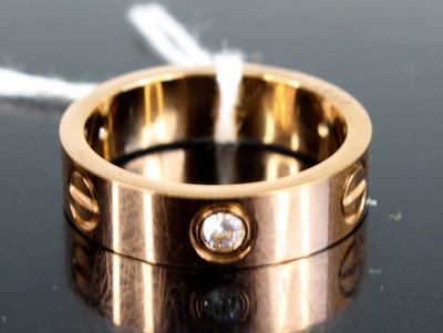 Lot 306 - A Cartier style gilt metal and paste set 'love'...