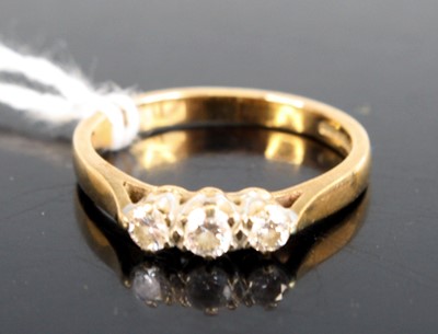 Lot 307 - A 9ct gold diamond trilogy ring, the three...