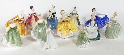 Lot 135 - A collection of Royal Doulton figures of...
