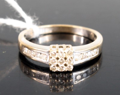 Lot 311 - A modern 9ct white gold and diamond dress ring,...