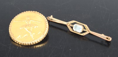 Lot 318 - A 9ct gold blue topaz set bar brooch, with...
