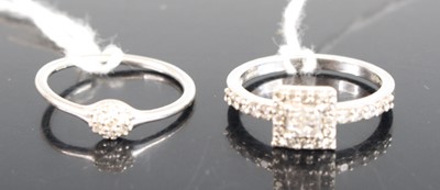 Lot 325 - A modern platinum and diamond dress ring,...