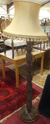 Lot 1217 - A Burmese profusely relief carved and turned...