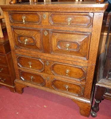 Lot 1227 - An antique joined and geometric oak chest of...