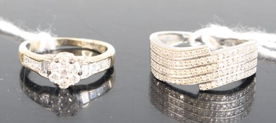 Lot 331 - A modern 9ct white gold diamond flower head...