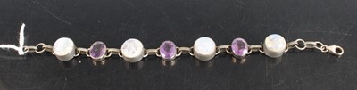 Lot 332 - A white metal cabochon moonstone and amethyst...