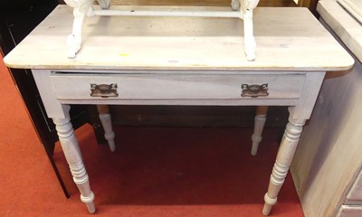 Lot 1239 - A Victorian lime-washed pine single drawer...