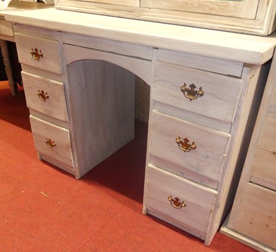 Lot 1240 - A rustic lime-washed pine kneehole desk,...