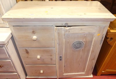 Lot 1242 - A rustic lime-washed pine low food cupboard,...