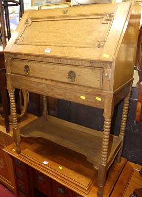 Lot 1247 - A 1920s oak slopefront student's bureau,...
