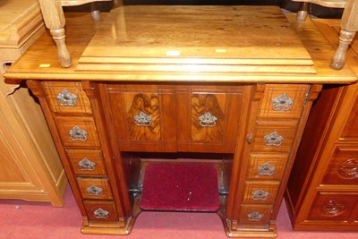 Lot 1248 - An Edwardian walnut sewing machine table,...