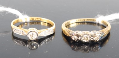Lot 342 - An 18ct gold and platinum diamond trilogy ring,...