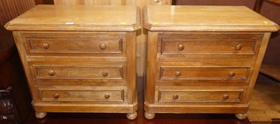 Lot 1261 - A pair of Belgian oak three-drawer bedside...