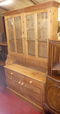 Lot 1266 - A contemporary pine dresser, with twin glazed...
