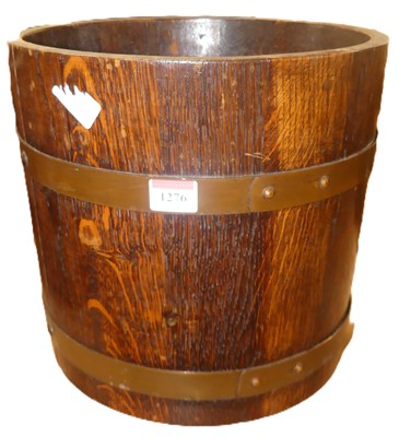 Lot 1276 - An early 20th century oak coopered jardiniere,...