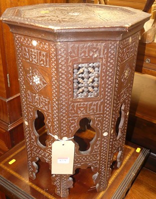 Lot 1279 - An Eastern stained and relief carved octagonal...