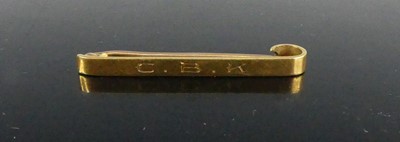 Lot 348 - An 18ct gold safety pin bar brooch having a...