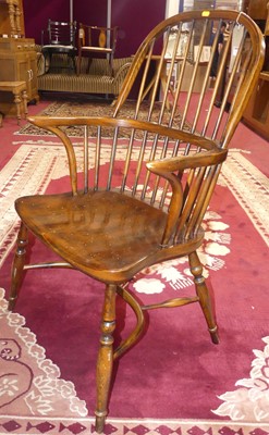 Lot 1322 - A contemporary elm stick back Windsor chair,...