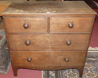 Lot 1375 - A small early 19th century oak chest of two...