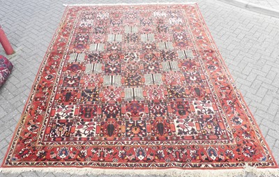 Lot 1202 - A large Persian woollen Bakhtiari red ground...