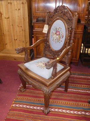 Lot 1326 - An Eastern relief carved and pierced teak...