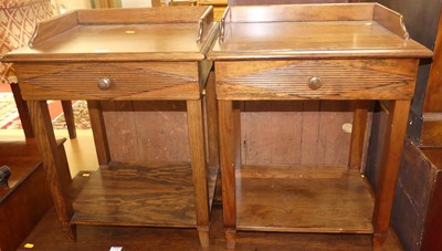 Lot 1347 - A pair of contemporary stained pine two-tier...