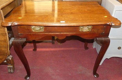 Lot 1355 - An antique oak and fruitwood shaped top single...