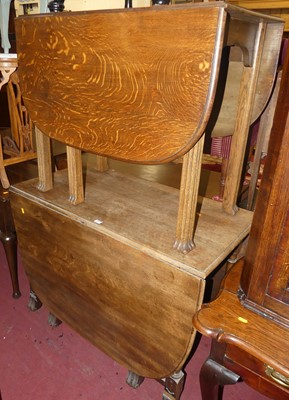 Lot 1357 - Two 1930s oak drop leaf dining tables, each...