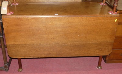 Lot 1366 - A George III oak drop-leaf pad foot dining...