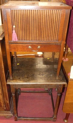 Lot 1367 - A 19th century mahogany tambour fronted pot...