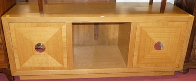 Lot 1371 - A contemporary blond oak veneered media unit,...