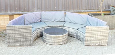 Lot 1384 - A contemporary rattan sectional curved garden...
