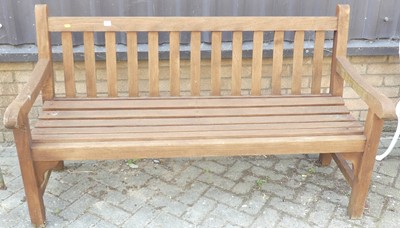 Lot 1386 - A contemporary stained and slatted teak...