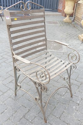 Lot 1387 - A painted wrought metal and strap work garden...