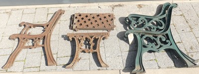 Lot 1393 - Two pairs of cast iron bench ends; together...