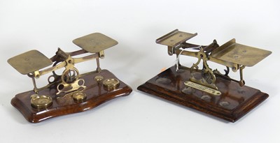 Lot 383 - An early 20th century brass postage scale,...