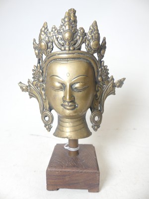 Lot 390 - A loaded brass sculpture of the head of Tara,...
